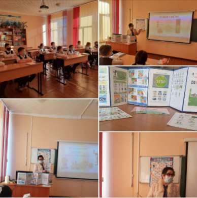 Библиотекарь школы К. Махашова среди учащихся 3 